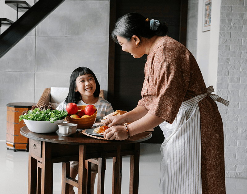 Mandarin Speaking Maid Communicating Happily with Family Member