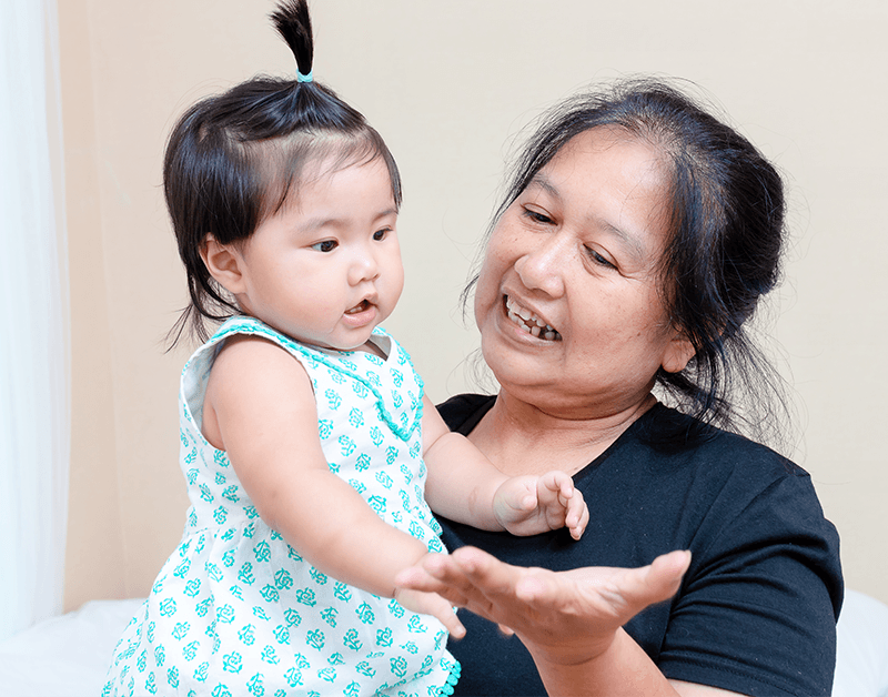 Experienced Nanny Nurturing an Infant in Home Setting